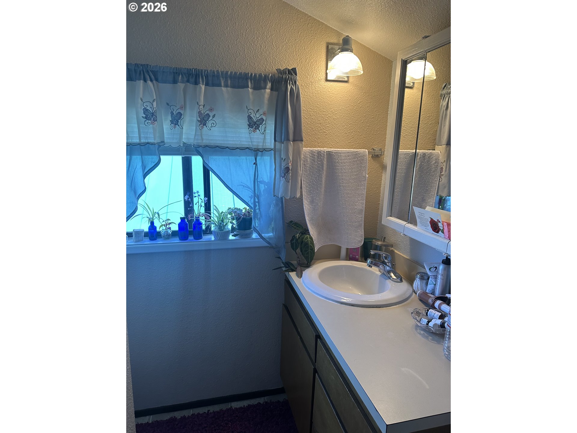2063 Alder Avenue Reedsport, OR 97467 - Photo 15 of 29 a bathroom with a sink toilet and mirror