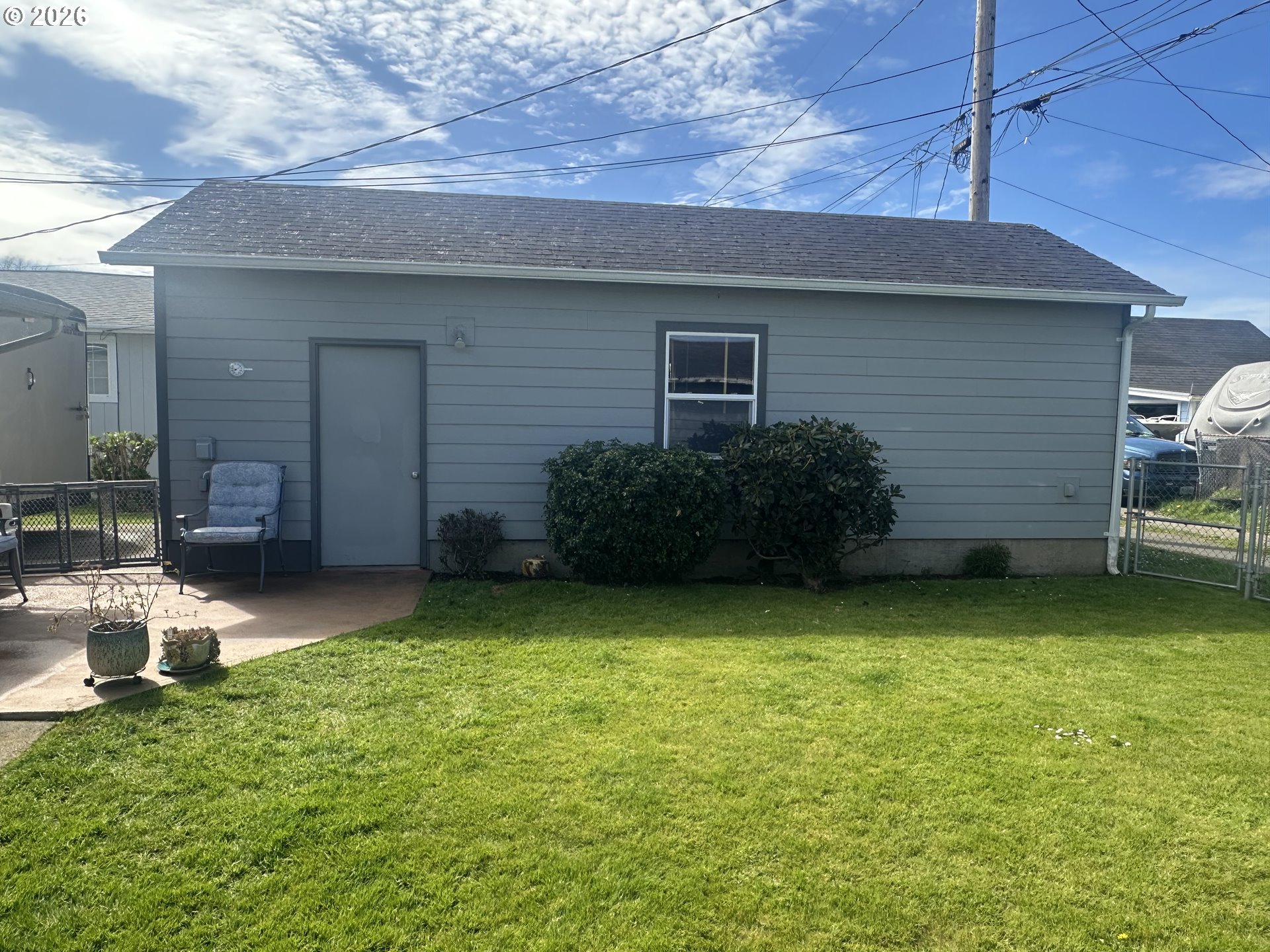 2063 Alder Avenue Reedsport, OR 97467 - Photo 19 of 29 a backyard of a house with seating space