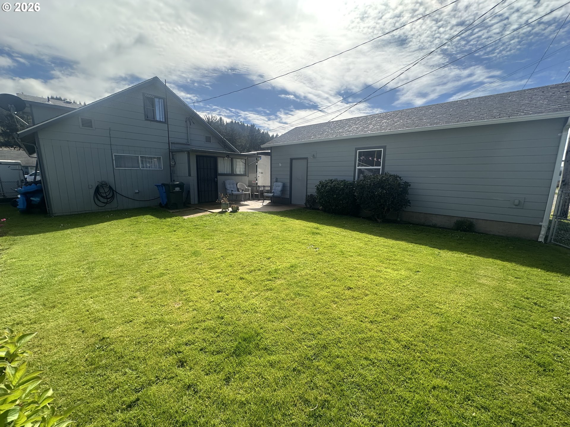2063 Alder Avenue Reedsport, OR 97467 - Photo 22 of 29 a view of a house with a yard