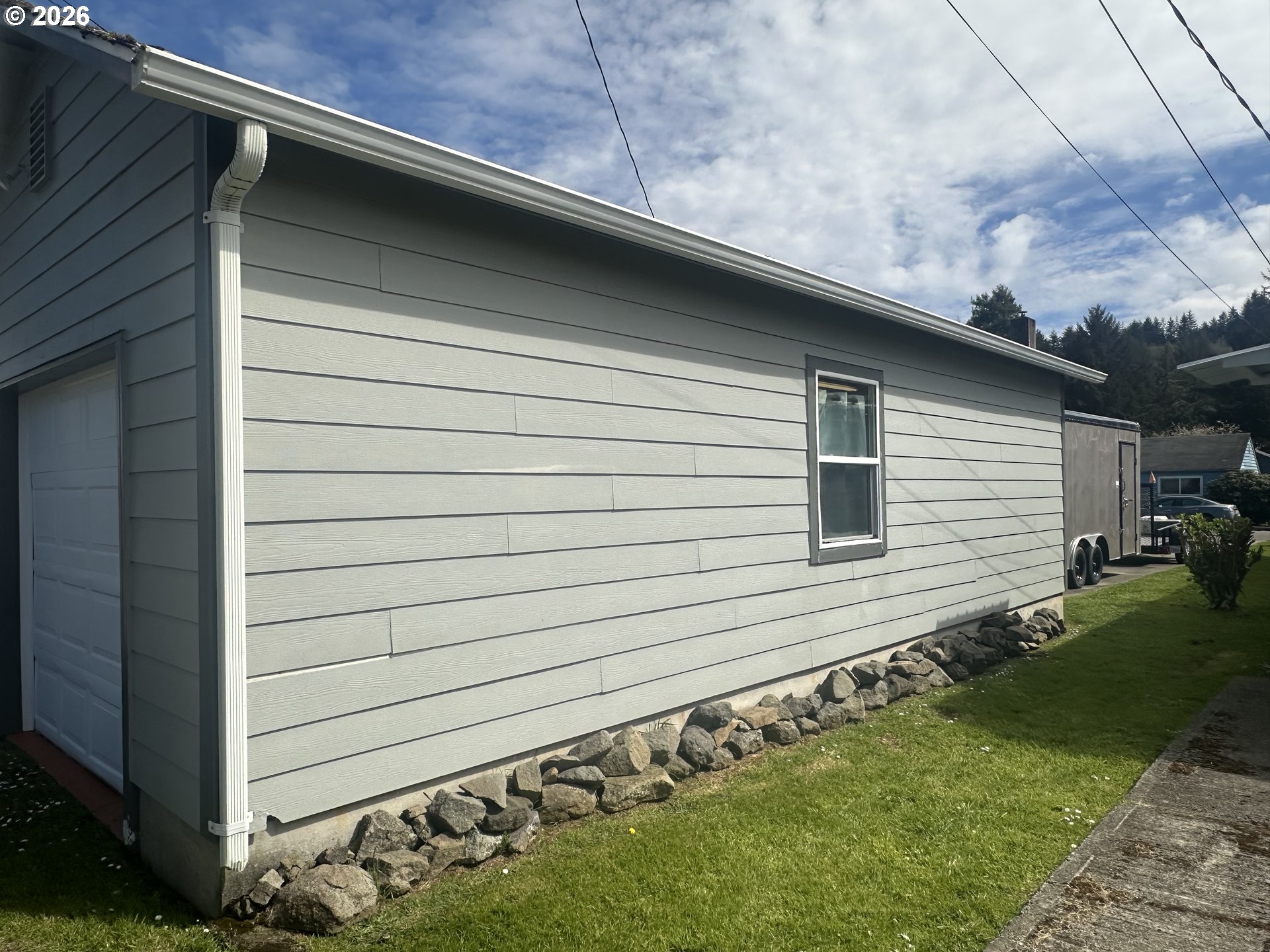 2063 Alder Avenue Reedsport, OR 97467 - Photo 24 of 29 a view of a house with a backyard