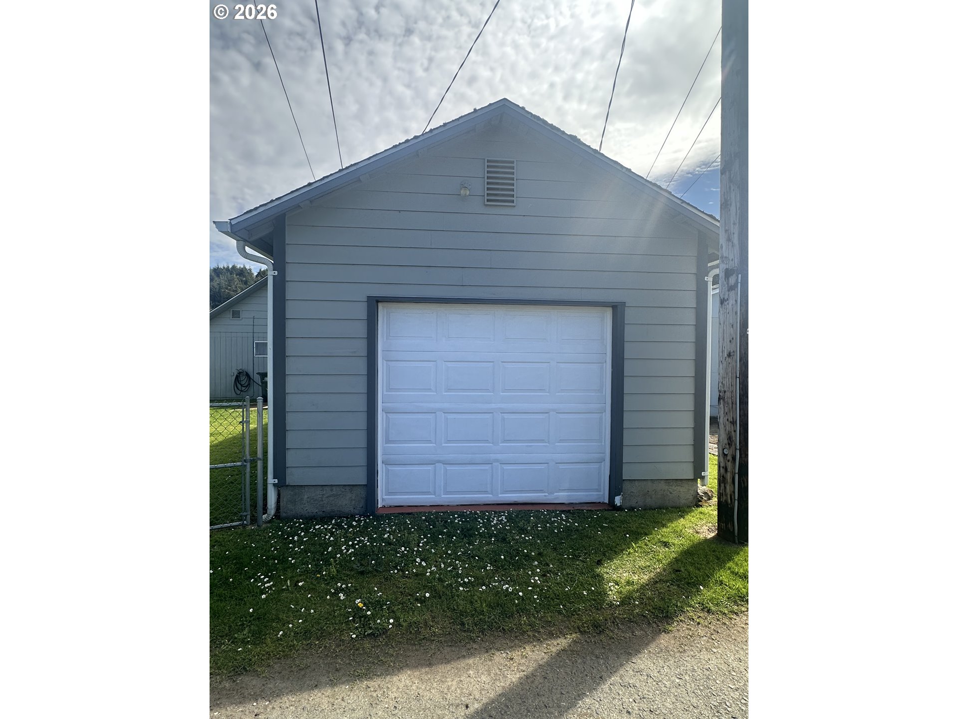 2063 Alder Avenue Reedsport, OR 97467 - Photo 25 of 29 a front view of a house with a garden