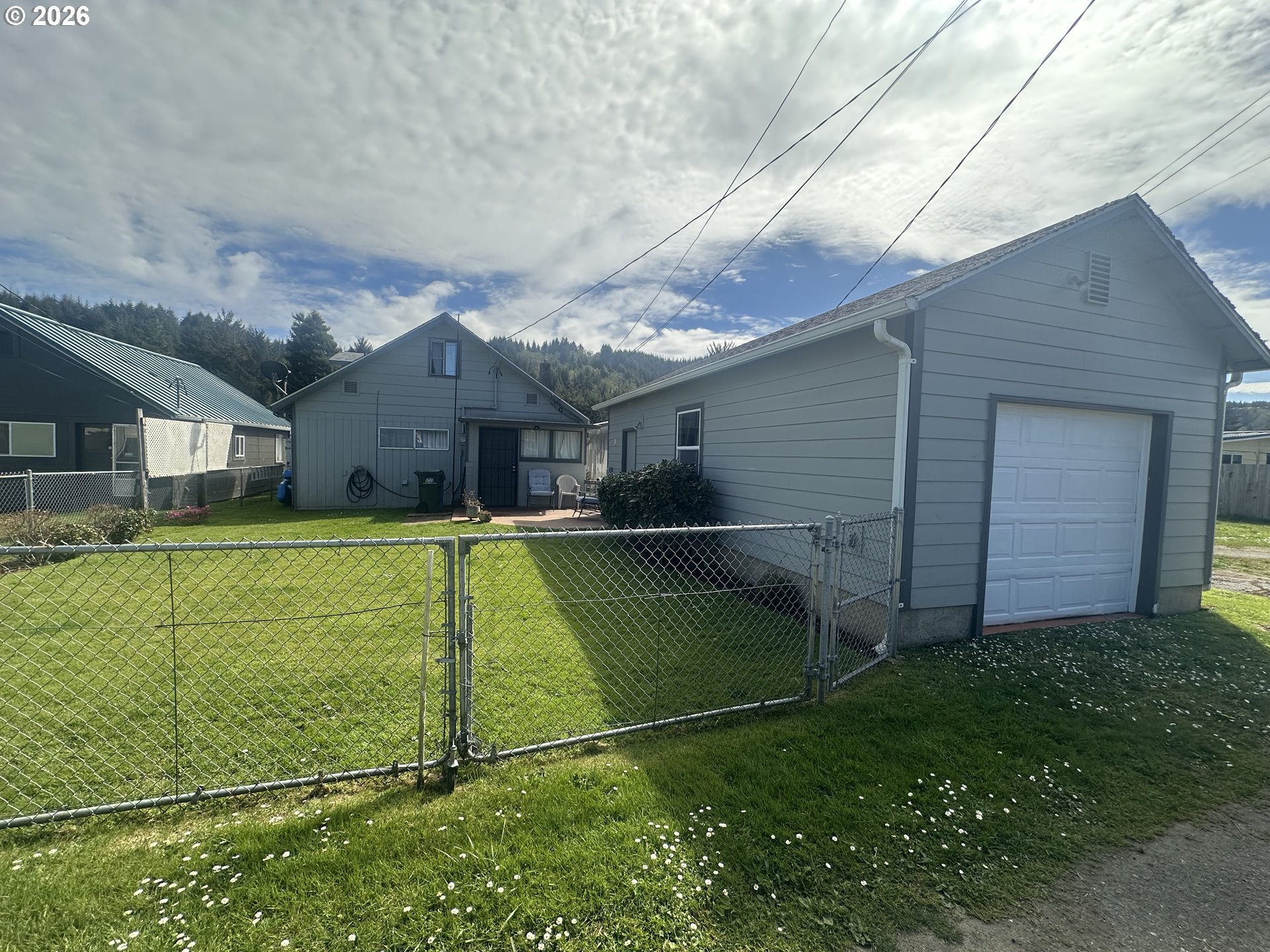 2063 Alder Avenue Reedsport, OR 97467 - Photo 26 of 29 a view of a house with backyard