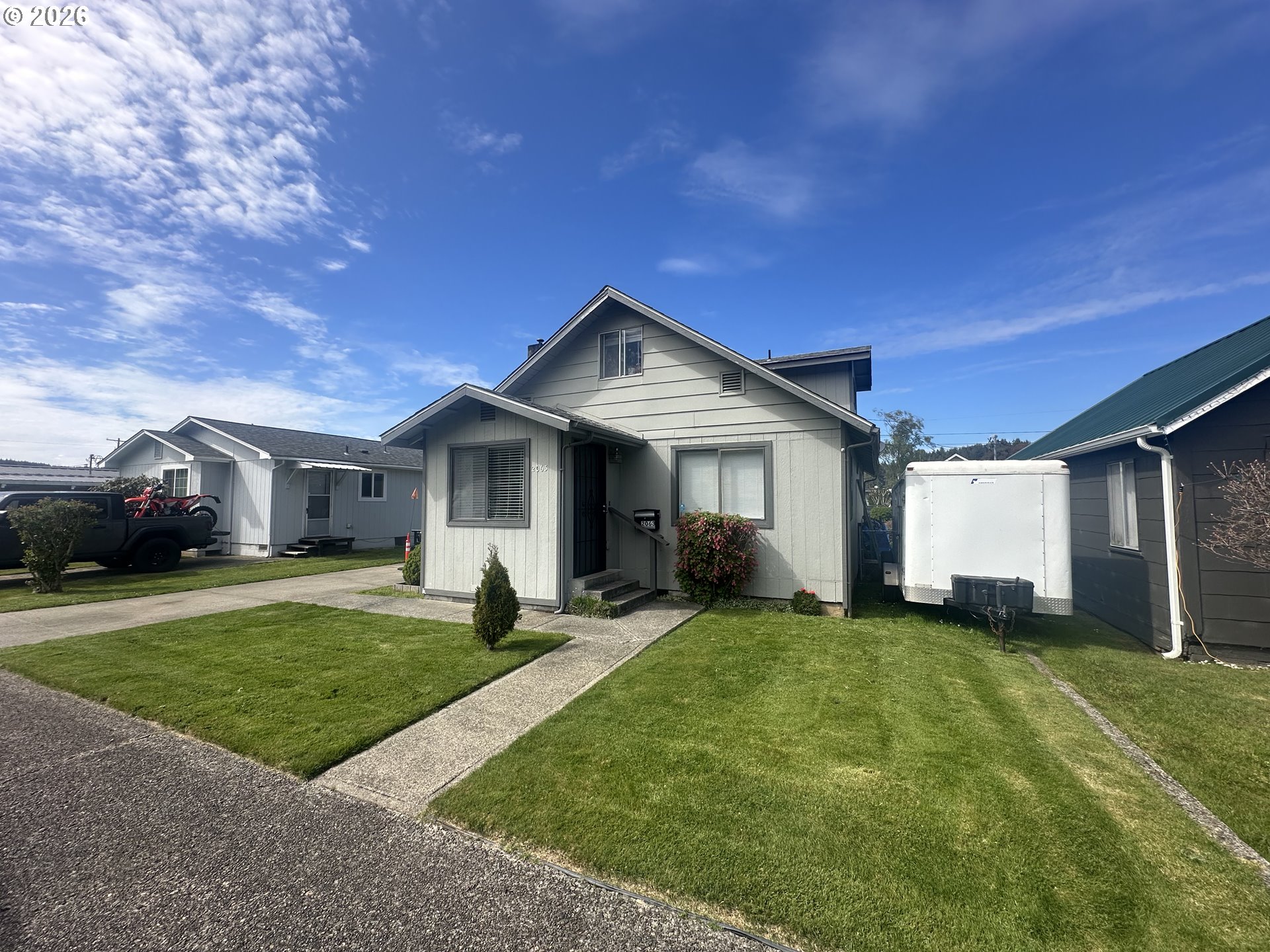 2063 Alder Avenue Reedsport, OR 97467 - Photo 27 of 29 a front view of a house with a yard