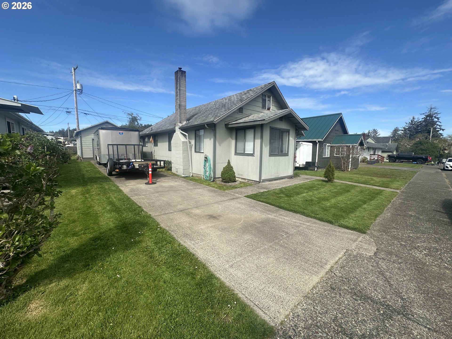 2063 Alder Avenue Reedsport, OR 97467 - Photo 28 of 29 a front view of a house with a yard