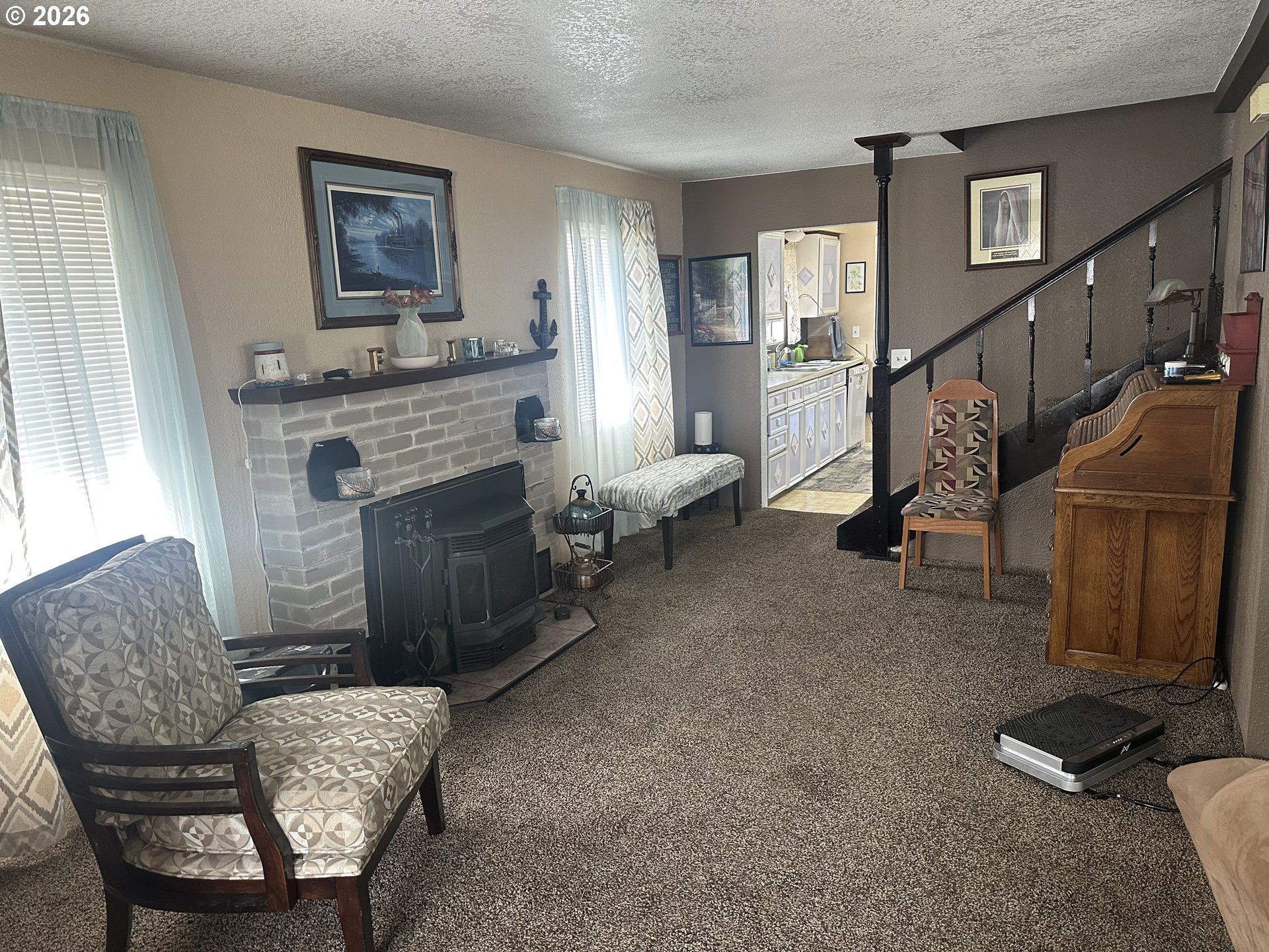 2063 Alder Avenue Reedsport, OR 97467 - Photo 3 of 29 a living room with furniture and a fireplace