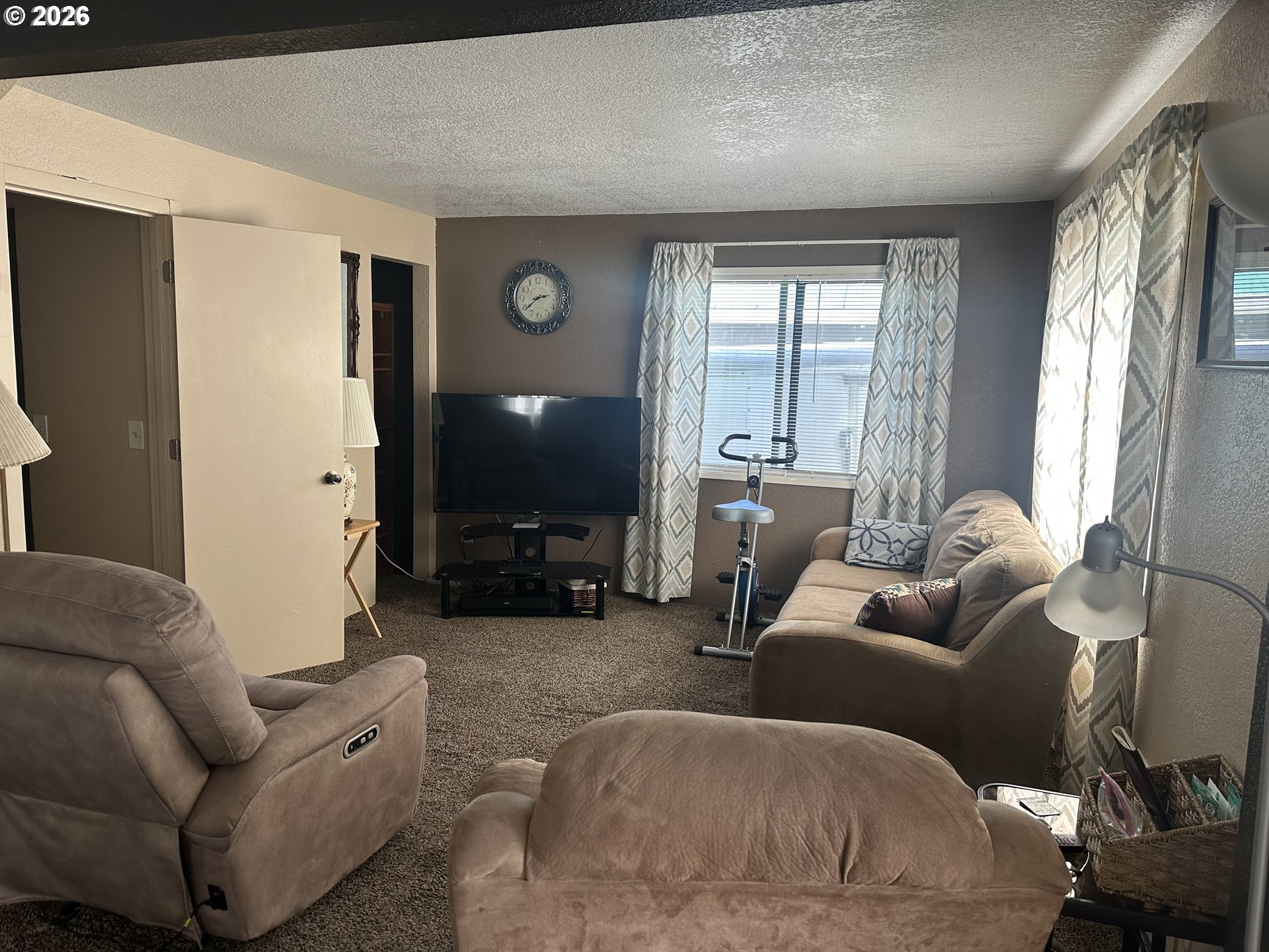 2063 Alder Avenue Reedsport, OR 97467 - Photo 4 of 29 a living room with furniture and a flat screen tv
