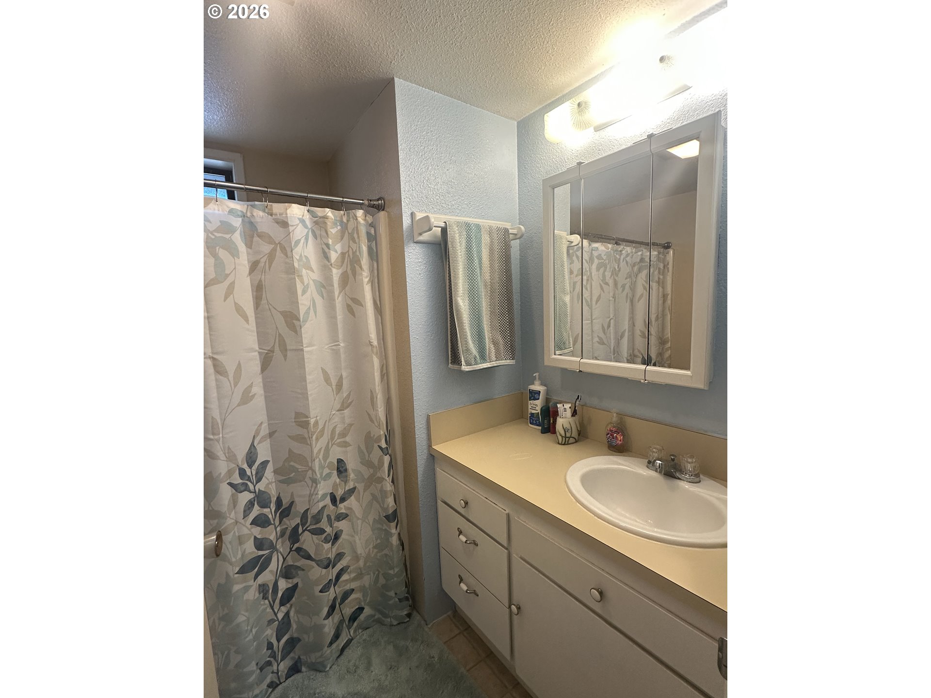 2063 Alder Avenue Reedsport, OR 97467 - Photo 8 of 29 a bathroom with a double vanity sink and mirror