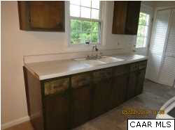 622 Stephens Loop Ruckersville, VA 22968 - Photo 5 of 14 a kitchen with a sink and a mirror