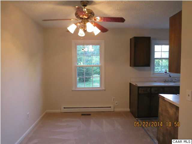 622 Stephens Loop Ruckersville, VA 22968 - Photo 6 of 14 an empty room with a fireplace and a window