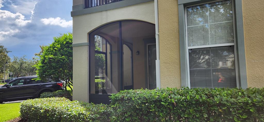 8180 Boat Hook Loop, Unit 310 Windermere, FL 34786 - Photo 2 of 11 a couple of potted plants in front of door