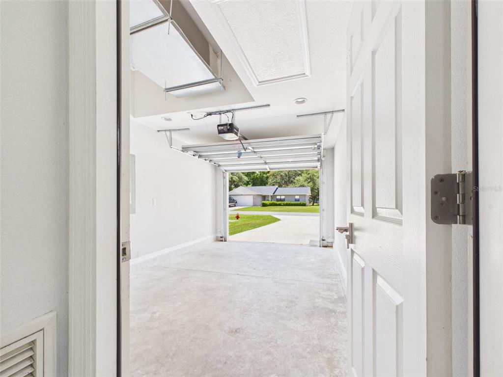 4309 Southwest 143rd Ln Road Ocala, FL 34473 - Photo 18 of 21 a view of a room with wooden floor and windows