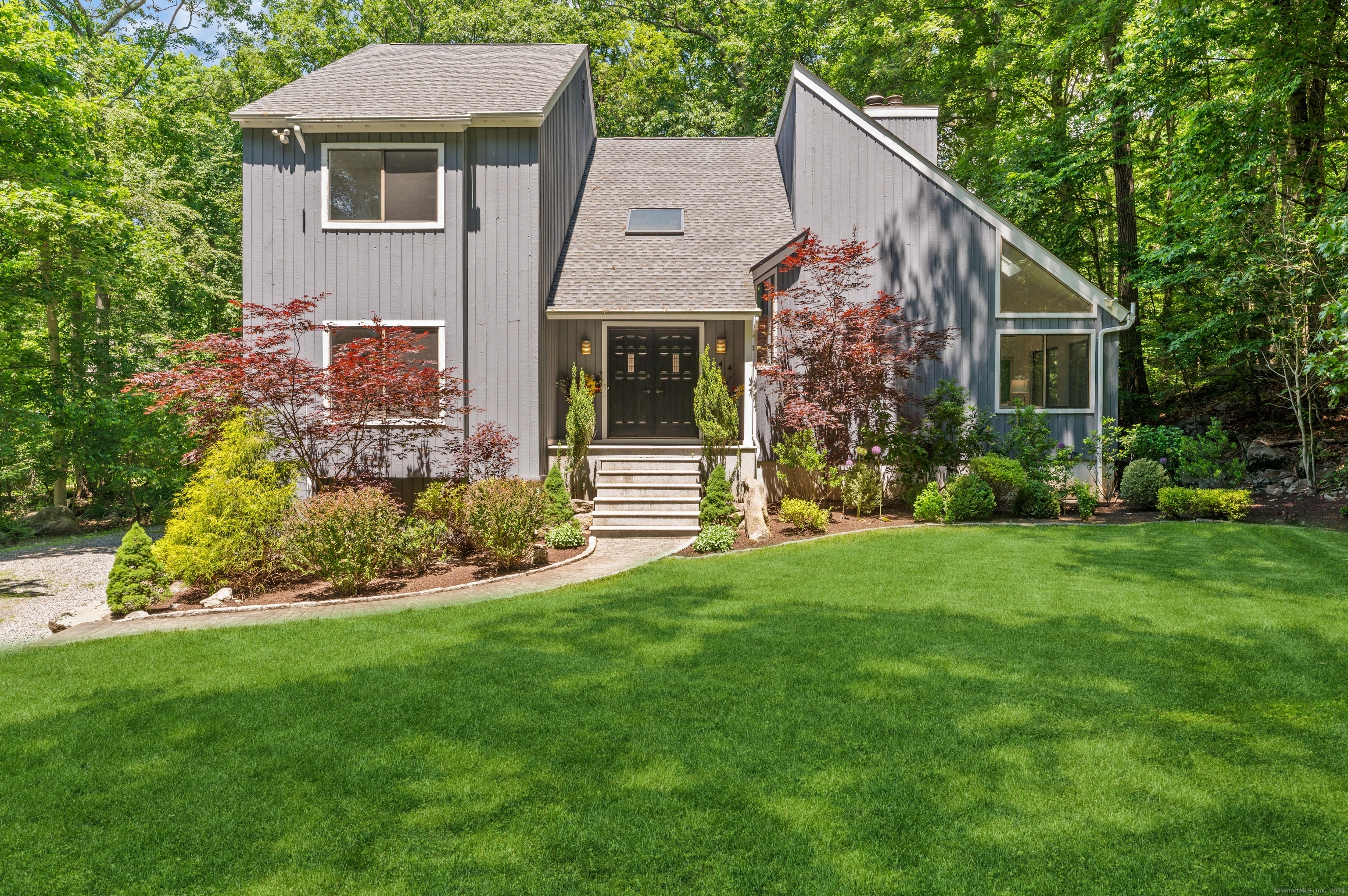 Welcome home to 44 Merriland, a stunning contemporary oasis in North Stamford