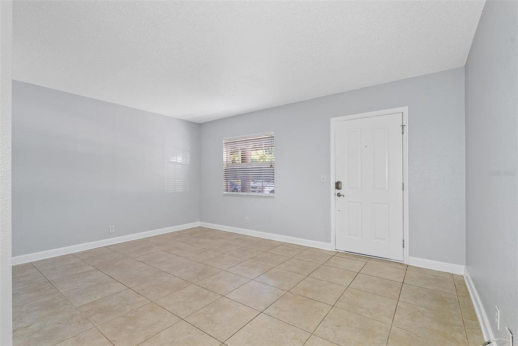 263 14th Street Northwest, Unit 3A Largo, FL 33770 - Photo 3 of 11 an empty room with windows