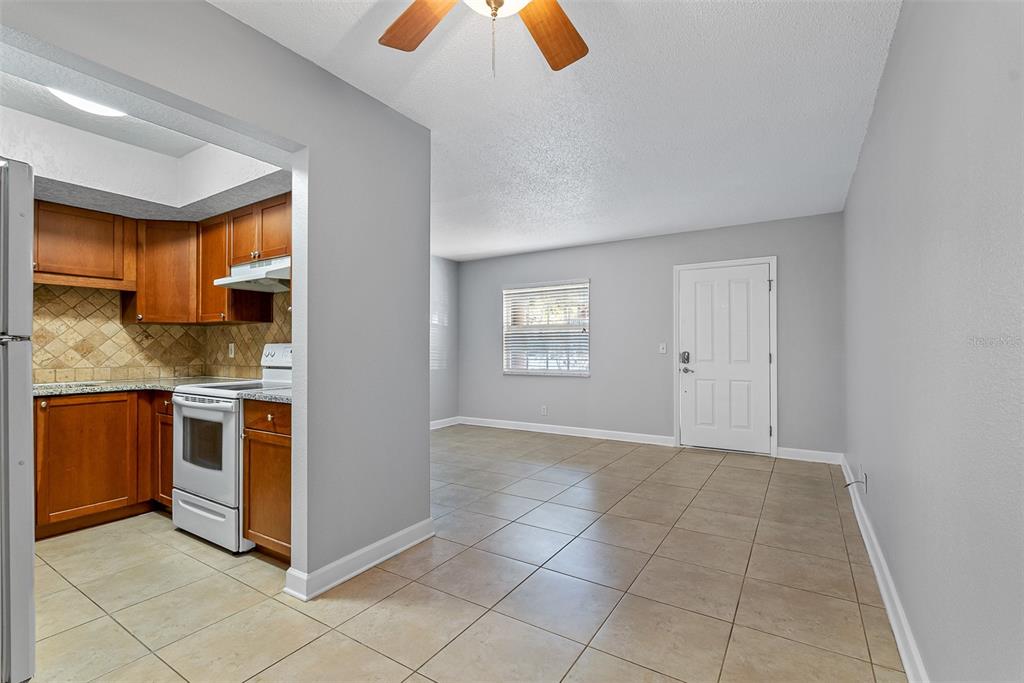 263 14th Street Northwest, Unit 3A Largo, FL 33770 - Photo 4 of 11 a view of kitchen with granite countertop cabinets