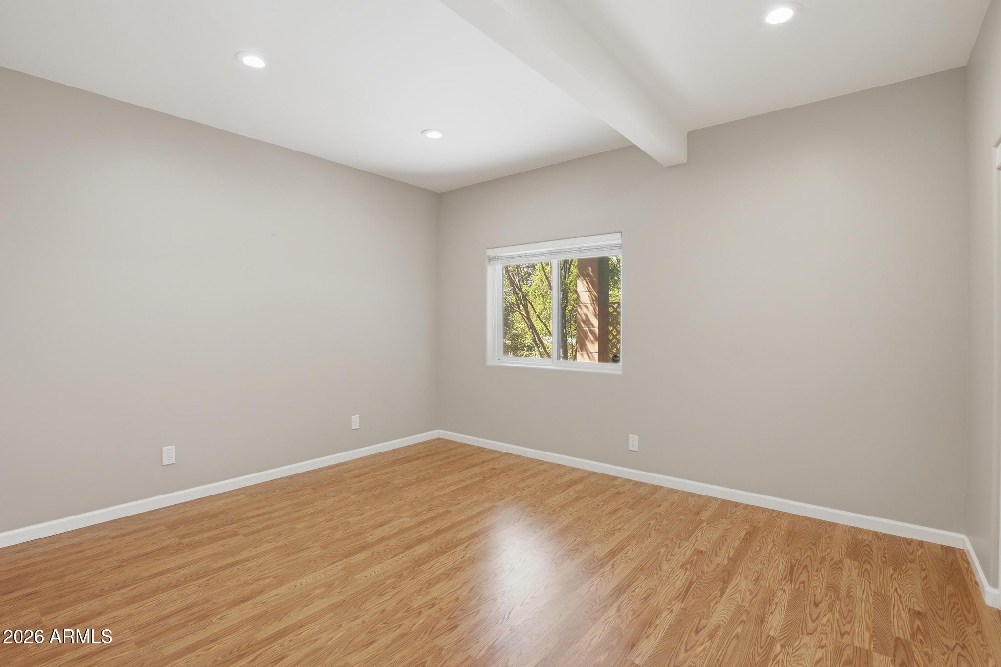 408 East Phoenix Street Payson, AZ 85541 - Photo 27 of 35 an empty room with wooden floor and windows