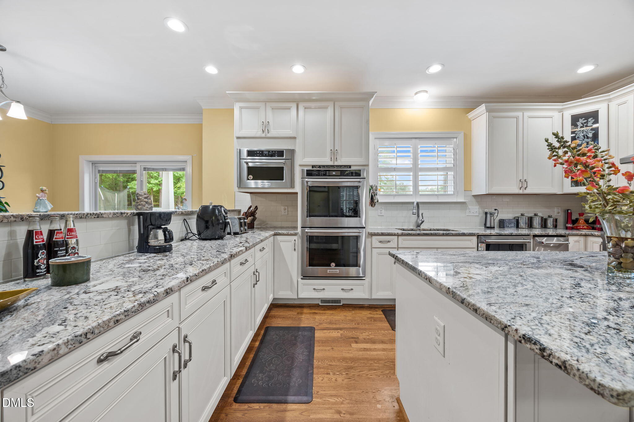 2880 Elevation Road Four Oaks, NC 27524 - Photo 16 of 51 a kitchen with stainless steel appliances granite countertop a sink and stove