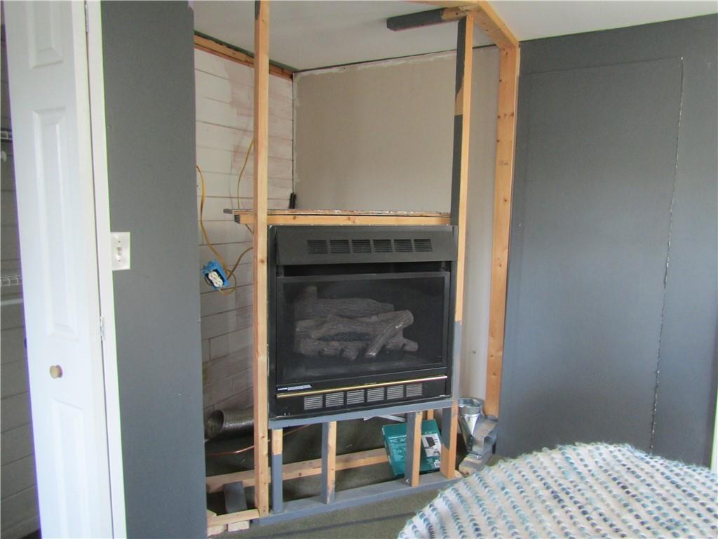 135 Mennonite Camp Road Mount Pleasant, PA 15666 - Photo 31 of 37 propane fireplace in bedroom