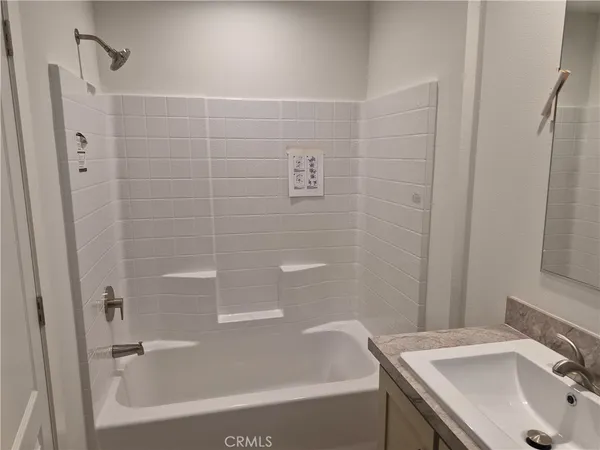 a bathroom with a sink and a bathtub