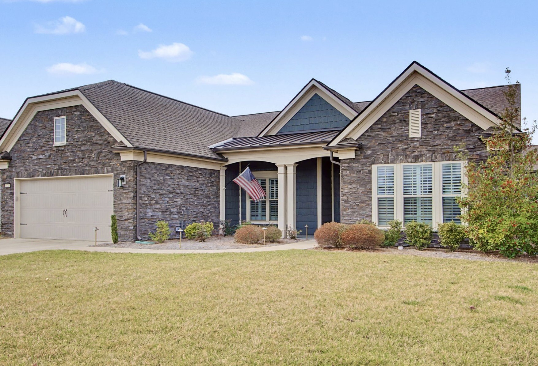 a front view of a house with garden