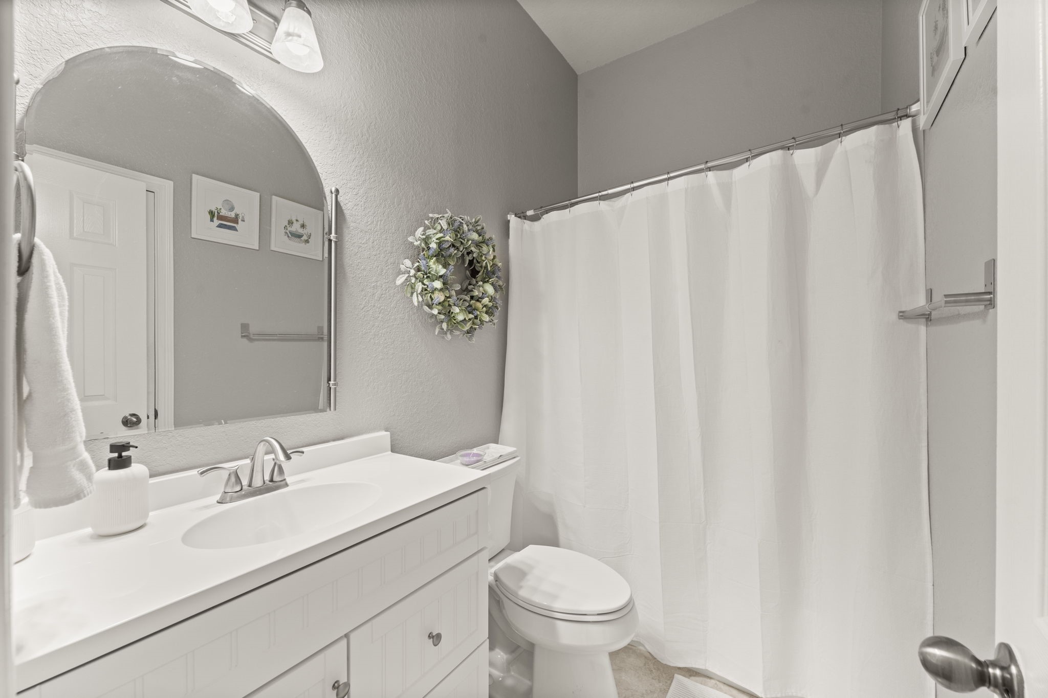 2217 Valley View Crossing Conroe, TX 77304 - Photo 16 of 24 a bathroom with a sink and a mirror