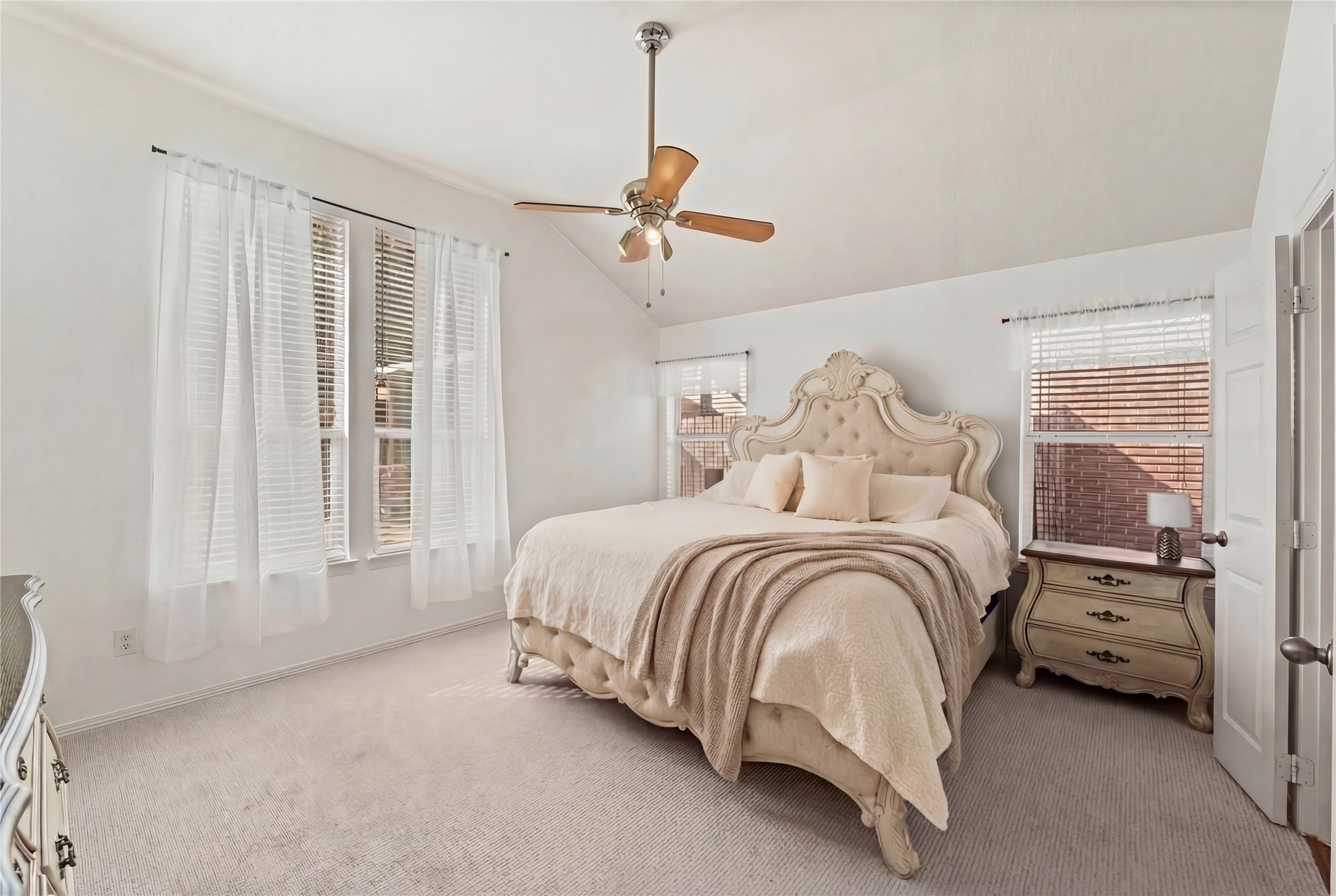 2217 Valley View Crossing Conroe, TX 77304 - Photo 23 of 24 a bedroom with a bed next to a window