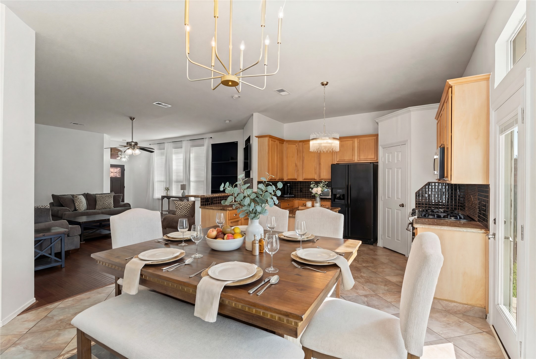 2217 Valley View Crossing Conroe, TX 77304 - Photo 8 of 24 a living room with furniture a large window and kitchen view