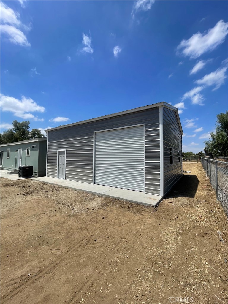 19165 Spalding Avenue Riverside, CA 92508 - Photo 7 of 32 Brand New Detached Steel Garage just added. Rear View , third door for pull through access.
