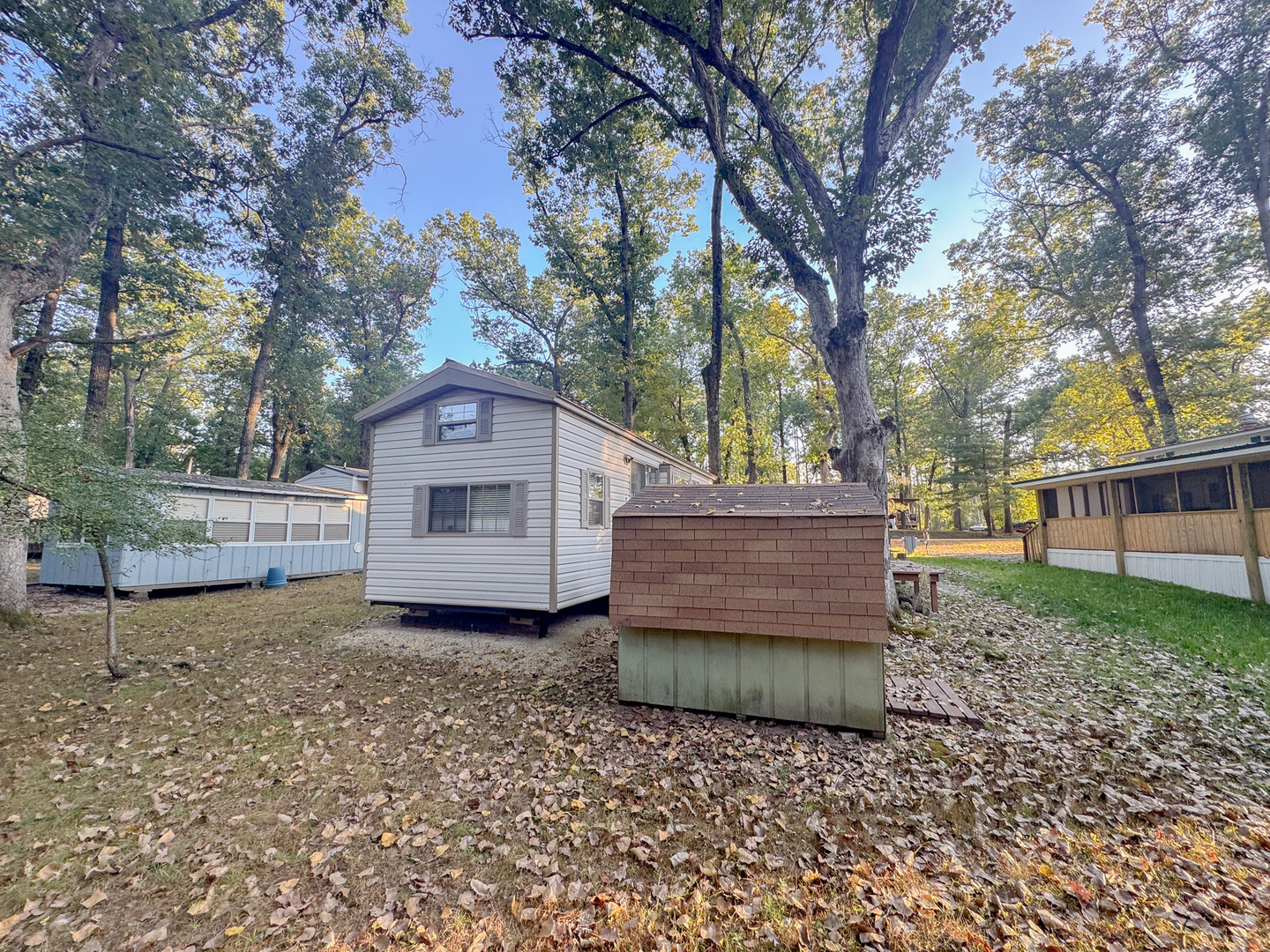 15-185 Woodhaven Sublette, IL 61367 - Photo 6 of 22 a wooden house covered with tall trees