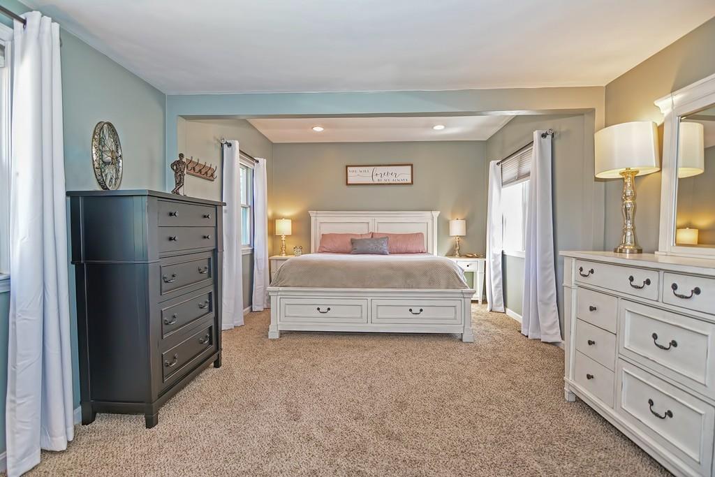 8 Edith Road Hudson, MA 01749 - Photo 13 of 26 a bedroom with a bed and a dresser