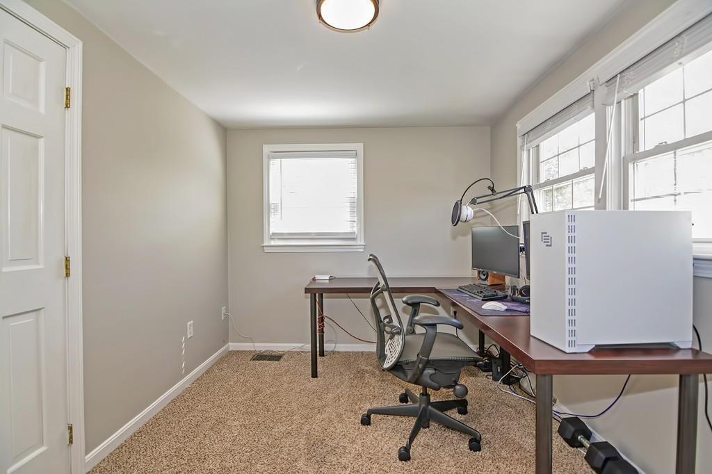 8 Edith Road Hudson, MA 01749 - Photo 22 of 26 a view of a workspace with furniture and a window