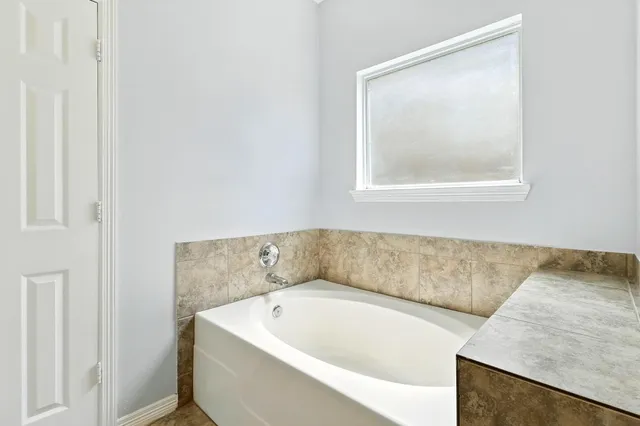 a bathroom with a bathtub