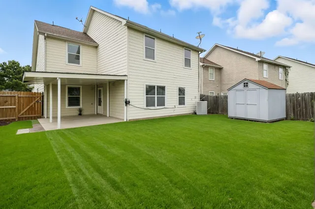 a view of a house with backyard