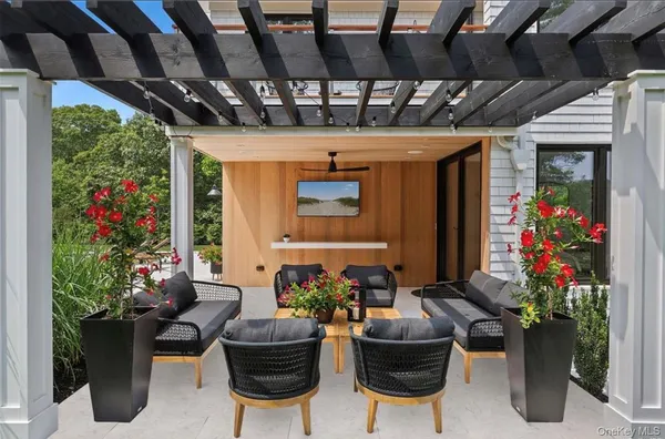 a lobby with a table and chairs in patio