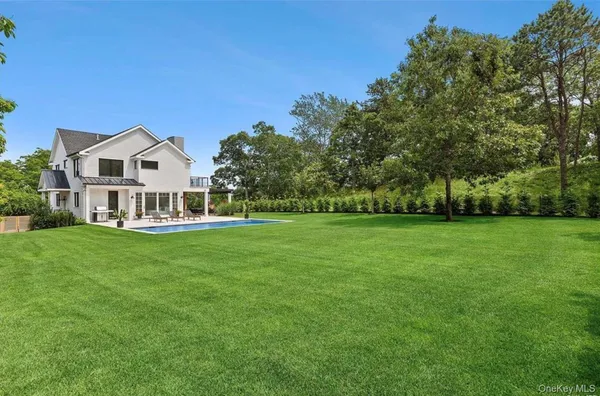 a view of a house with a big yard
