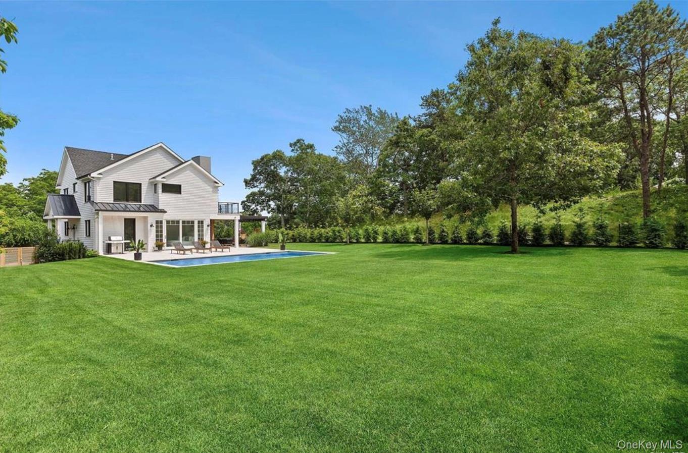 28 Canoe Place Road Hampton Bays, NY 11946 - Photo 27 of 34 a view of a house with a big yard
