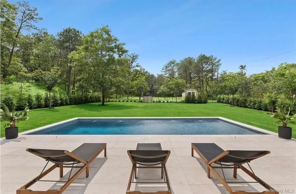 a view of outdoor space yard swimming pool and green space