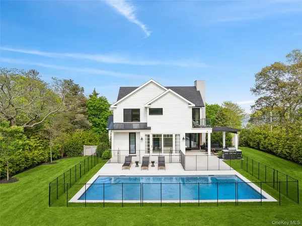 a view of house that has a yard