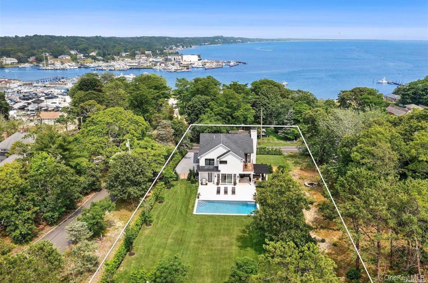 28 Canoe Place Road Hampton Bays, NY 11946 - Photo 3 of 34 a view of a city