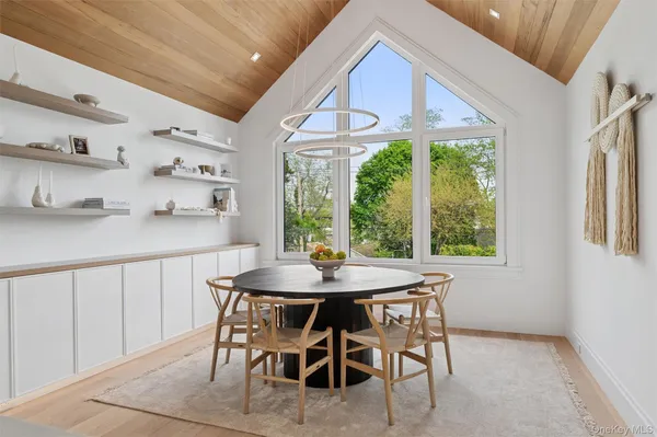 a dining room with furniture and window