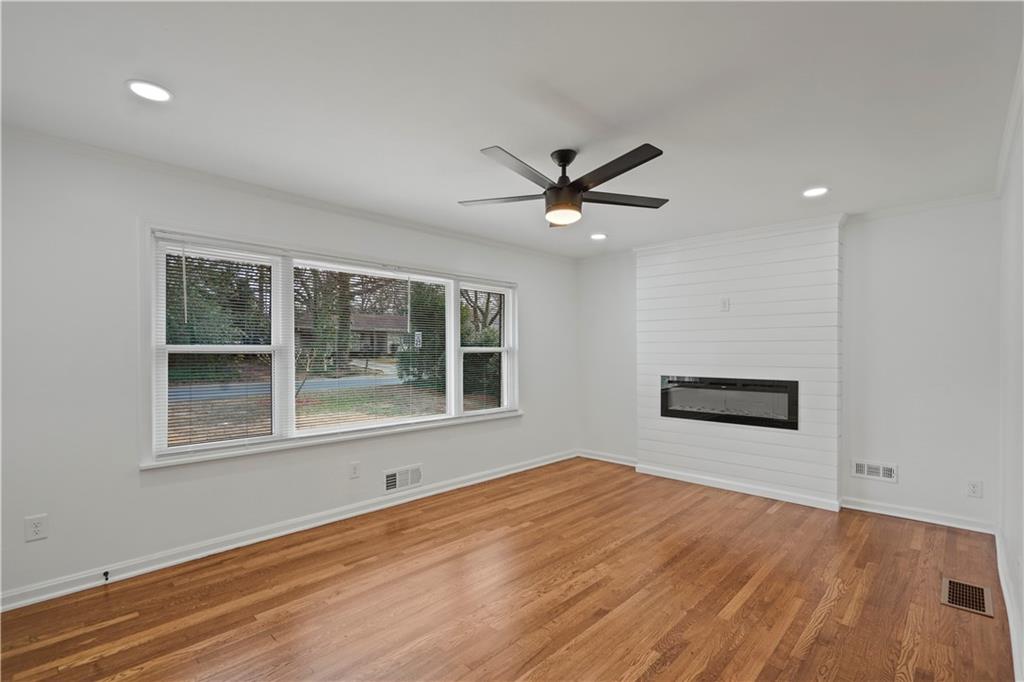 134 Normandy Drive Southwest Marietta, GA 30064 - Photo 12 of 26 a view of a big room with wooden floor and windows