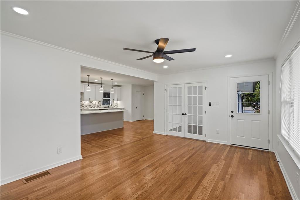 134 Normandy Drive Southwest Marietta, GA 30064 - Photo 13 of 26 a view of a kitchen with wooden floor and a ceiling fan