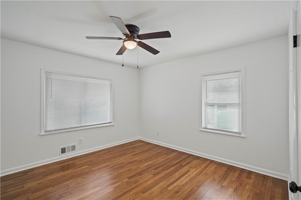 134 Normandy Drive Southwest Marietta, GA 30064 - Photo 21 of 26 a view of empty room with wooden floor and fan