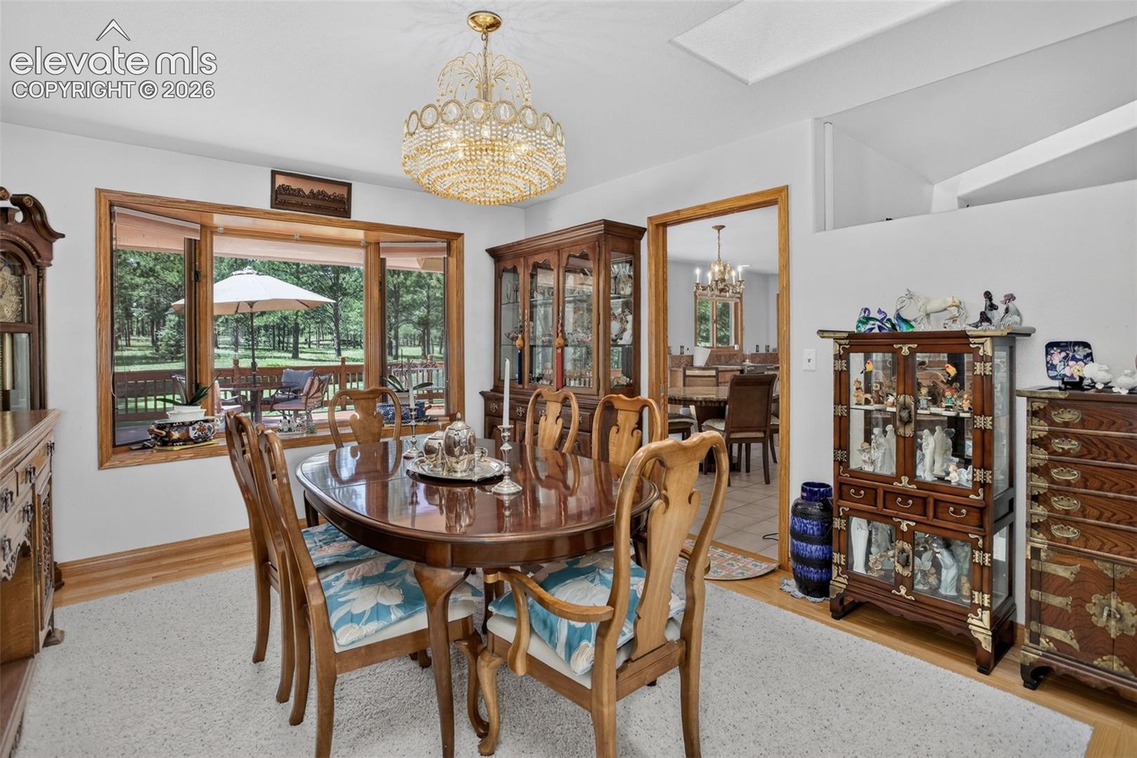 11570 Milford Road Elbert, CO 80106 - Photo 15 of 49 Formal dining area with skylights and access to kitchen.