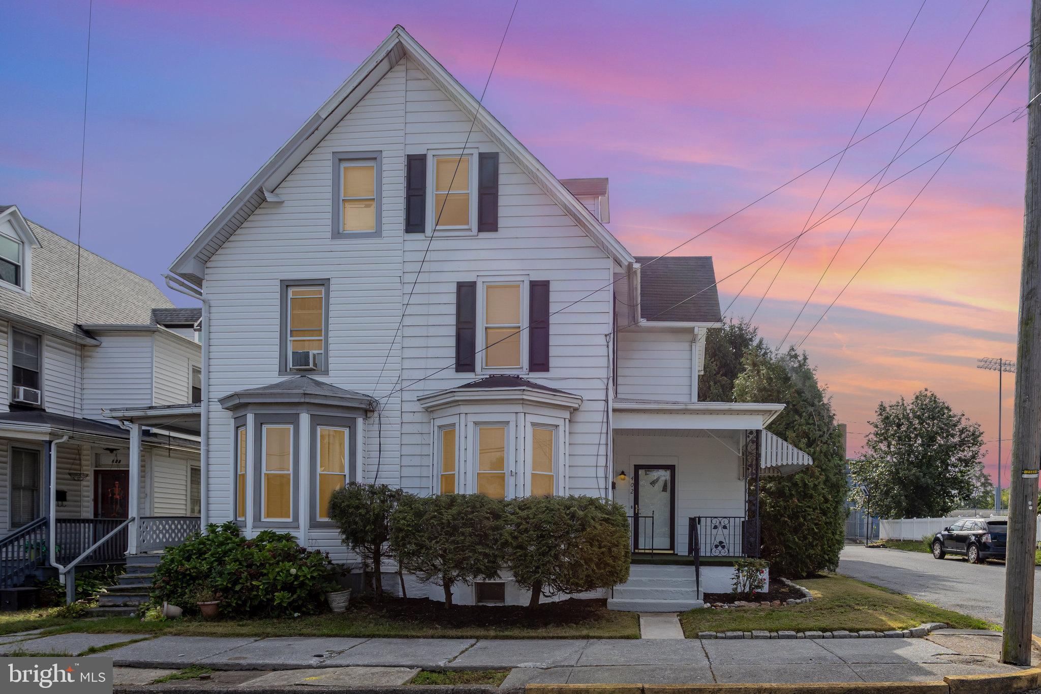 402 Spruce Street Steelton, PA 17113 - Photo 1 of 32 a front view of a house with a yard