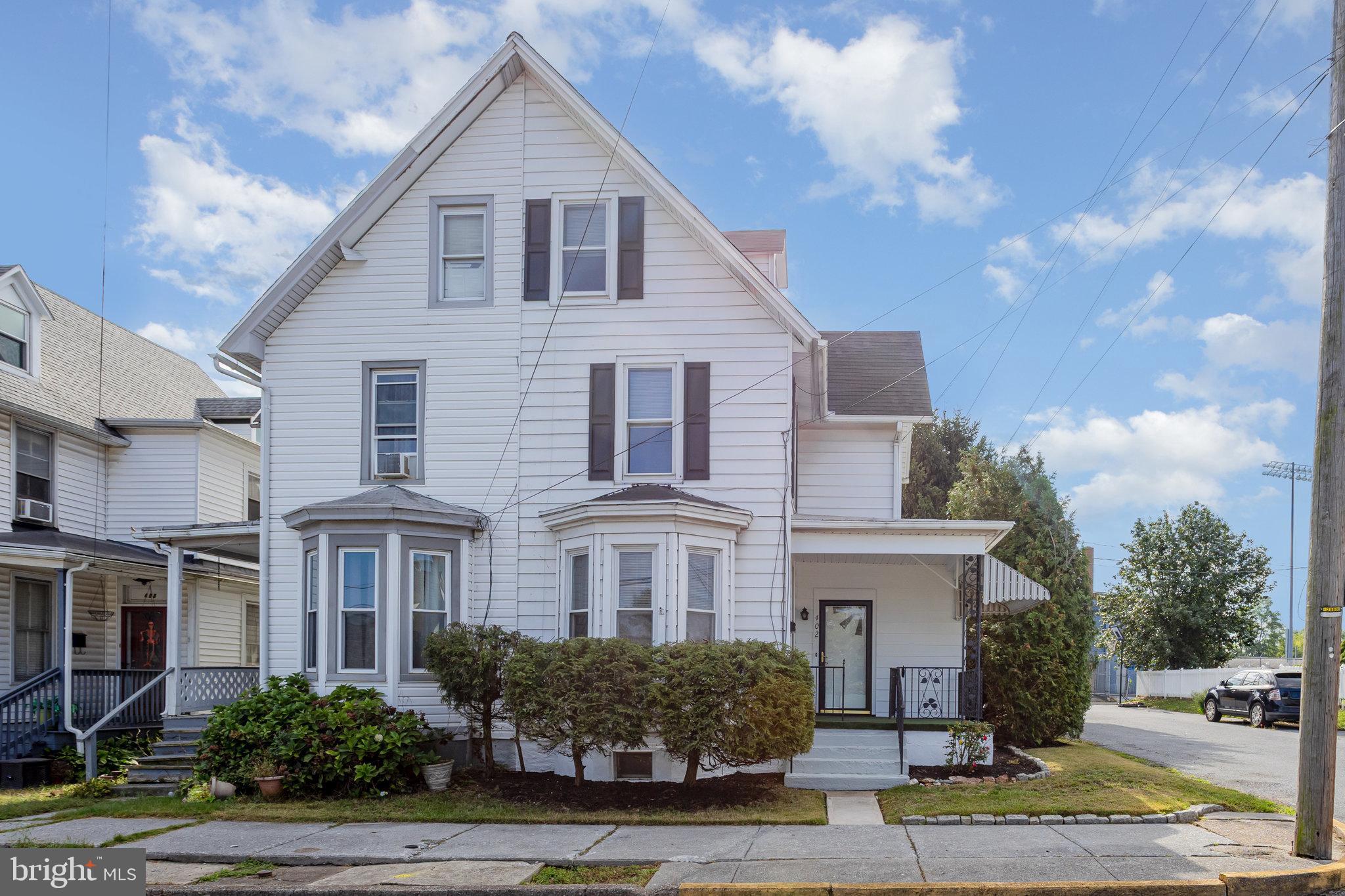 402 Spruce Street Steelton, PA 17113 - Photo 2 of 32 a front view of a house with a yard