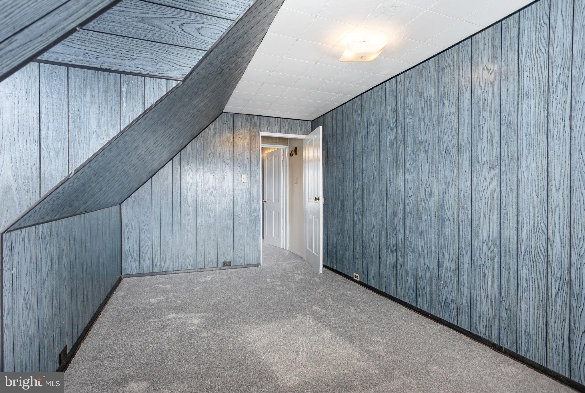 402 Spruce Street Steelton, PA 17113 - Photo 24 of 32 a view of an empty room with wooden walls