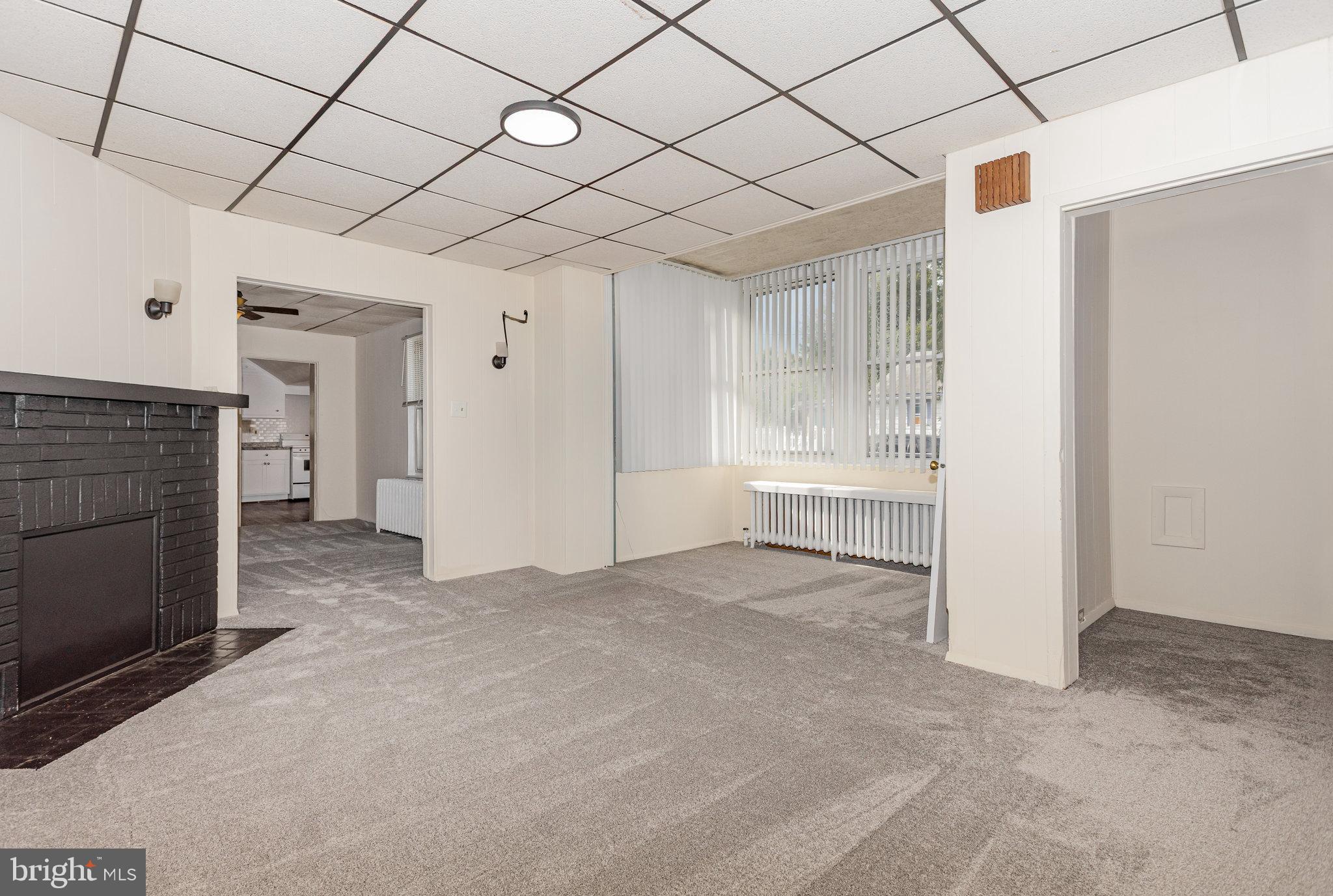 402 Spruce Street Steelton, PA 17113 - Photo 7 of 32 a view of a livingroom with an empty space and a fireplace