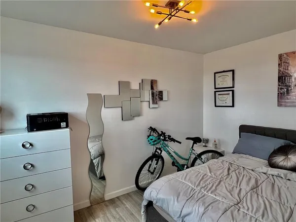 a view of a livingroom with furniture and a flat screen tv
