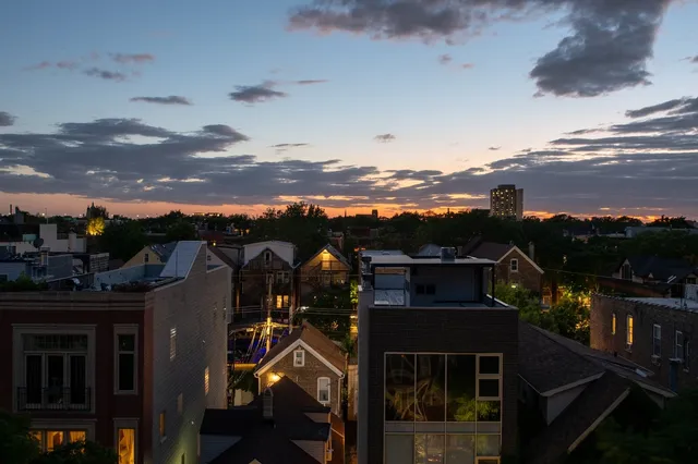 a view of a city with lots of car parked