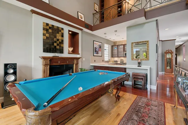 a room with pool table table and chairs